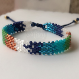 Pulsera tejida en miyuki azules y dorados