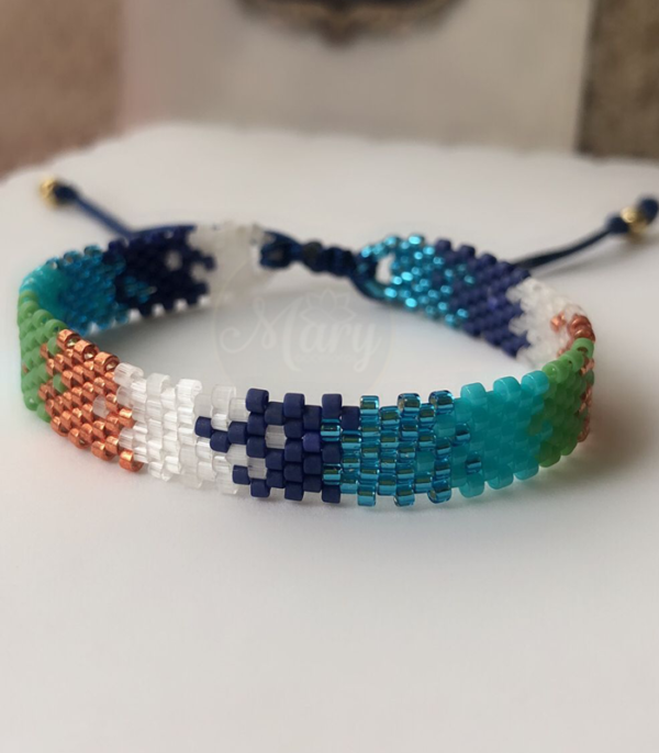 Pulsera tejida en miyuki azules y dorados